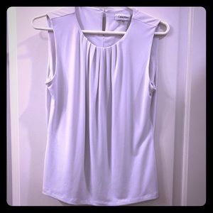 White sleeveless blouse